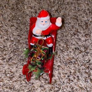 Vintage plastic Santa in a lightweight plastic sleigh.  Probably 1960-70’s